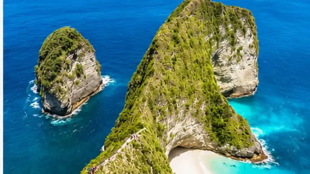 The Kelingking headland of Nusa Penida, a green ridge dropping to a white beach, seen from above with deep blue sea around it